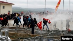 Security forces use water cannons to disperse protesters outside a courthouse where a hearing on people charged with attempting to overthrow Prime Minister Tayyip Erdogan's Islamist-rooted government is due to take place, in Silivri, Turkey, April 8, 2013.
