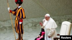 Pope Francis leads a special audience to deliver a Christmas message to Vatican workers at the Paul VI Hall at the Vatican, Dec. 23, 2021.