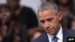 US President Barack Obama pauses speaks during an interfaith memorial service for the victims of the Dallas police shooting at the Morton H. Meyerson Symphony Center on July 12, 2016 in Dallas, Texas.