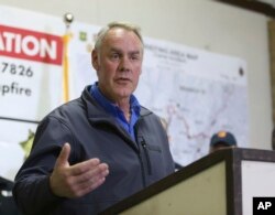 Ryan Zinke, Secretary of the Interior responds to a reporters question during a news conference after touring the fire ravaged town of Paradise, Calif., Nov. 14, 2018.