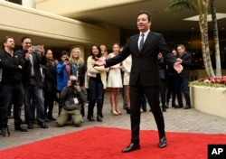 Jimmy Fallon, host of this Sunday's 74th Annual Golden Globe Awards, poses after rolling out the red carpet during Golden Globe Awards Preview Day at the Beverly Hilton on Wednesday, Jan. 4, 2017, in Beverly Hills, Calif.