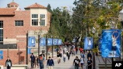 FILE - Students walk on the UCLA campus in Los Angeles, Feb. 26, 2015.