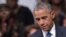 US President Barack Obama pauses speaks during an interfaith memorial service for the victims of the Dallas police shooting at the Morton H. Meyerson Symphony Center on July 12, 2016 in Dallas, Texas.