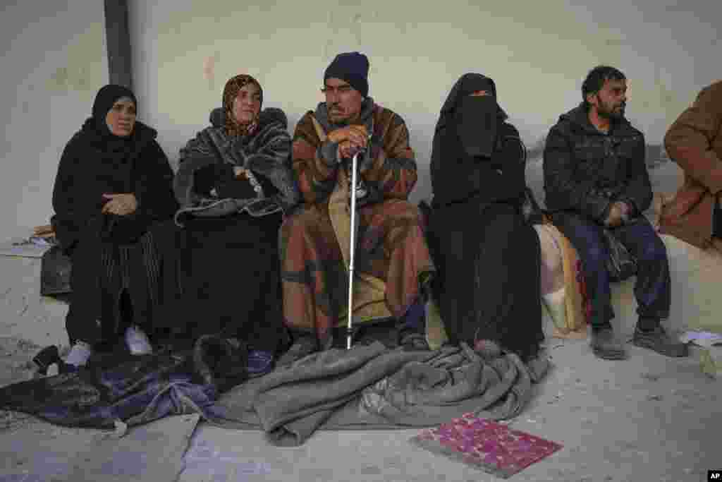 People with relatives who were imprisoned wait outside the infamous Saydnaya military prison, just north of Damascus, Syria, Dec. 9, 2024. 