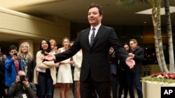 Jimmy Fallon, host of this Sunday's 74th Annual Golden Globe Awards, poses after rolling out the red carpet during Golden Globe Awards Preview Day at the Beverly Hilton on Wednesday, Jan. 4, 2017, in Beverly Hills, Calif.