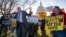 Sen. Bernie Sanders, I-Vt., joins protesters outside the Capitol as Republicans in the Senate work to pass their sweeping tax bill.