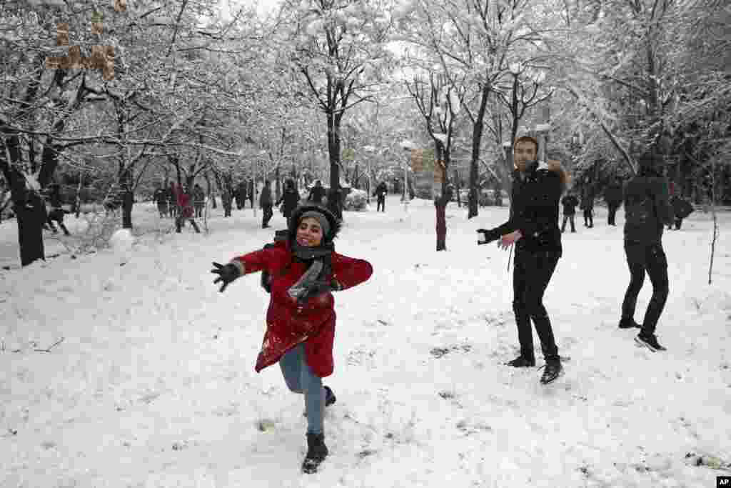 Iranian university students throw snowballs in Laleh Park in central Tehran, Jan. 28, 2018.
