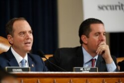 House Intelligence Committee Chairmen Rep. Adam Schiff, D-Calif., left, gives opening remarks as ranking member Rep. Devin Nunes, R-Calif., left, looks on.