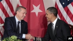 President Barack Obama, right, is seen during his bilateral meeting with Prime Minister of Turkey Recep Tayyip Erdogan, left, in New York, September, 20, 2011.