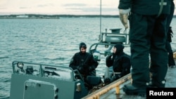 Navy divers of the Latvian Armed Forces take part in NATO exercise Freezing Winds 24, led by the Finnish Navy, in the Gulf of Finland, the Baltic Sea, Finland, November 23, 2024. Finnish Defence Forces/Handout via REUTERS 