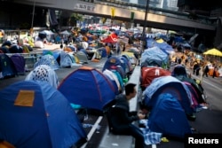 FILE - Protesters and tents occupy the main road to the financial district in Hong Kong, Dec. 9, 2014.