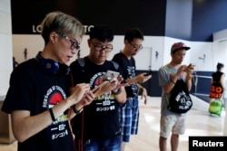 Participants take part in the world's first Pokemon Go competition in Hong Kong, China, Aug. 6, 2016.