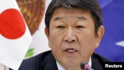 Japan's Economy Minister Toshimitsu Motegi says, Jan. 23, 2018, eleven countries aiming to forge an Asia-Pacific trade pact after the United States pulled out of an earlier version will sign an agreement in Chile in March.