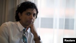 FILE - Director M. Night Shyamalan poses for portrait during the 2015 Comic-Con International Convention in San Diego, California, July 9, 2015.
