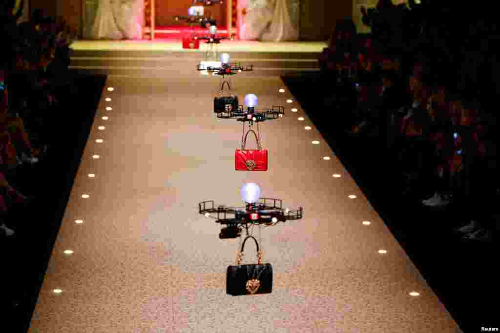 Drones carry handbags, the creations from the Dolce &amp; Gabbana Autumn/Winter 2018 women&#39;s collection during Milan Fashion Week in Milan, Italy.