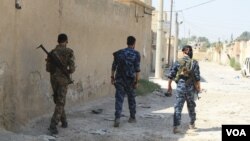 Syrian Democratic Forces patrol areas of Raqqa they controlled on Aug. 16, 2017. As IS was defeated, the people fled. Recaptured mid-October, the city is now nearly destroyed and entirely abandoned. (H. Murdock/VOA)