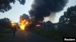 A gas tanker explodes in Boksburg, South Africa Dec. 24, 2022, in this screen grab from a video obtained by Reuters.