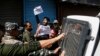 Indian policemen detain Kashmiri Shiite Muslims as they shout pro-freedom slogans after they made an attempt at a religious procession during restrictions in Srinagar, Indian controlled Kashmir, Sept. 8, 2019. 