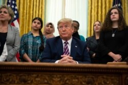 FILE - President Donald Trump listens to a question during an event on prayer in public schools, in the Oval Office of the White House, Jan. 16, 2020, in Washington.