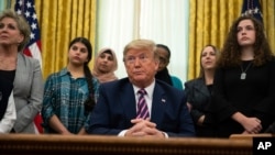 President Donald Trump listens to a question during an event on prayer in public schools, in the Oval Office of the White House, Jan. 16, 2020, in Washington. 
