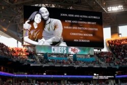 FILE - Kobe Bryant and his daughter Gianna are honored along with all of the helicopter crash victims before the NFL Super Bowl game between the San Francisco 49ers and Kansas City Chiefs in Miami Gardens, Fla., Feb. 2, 2020.