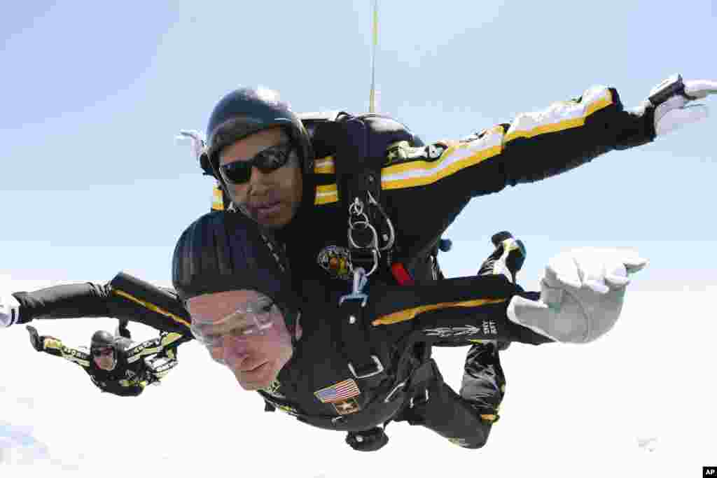 Former President George H. W. Bush rides tandem with Sgt. Michael Elliott of the Army Golden Knights parachute team as he celebrates his 85th birthday with a parachute jump, June 12, 2009, in Kennebunkport, Maine. (Army Golden Knights)