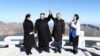 South Korean President Moon Jae-in and North Korean leader Kim Jong Un pose for photographs on the top of Mt. Paektu, North Korea, Sept. 20, 2018.