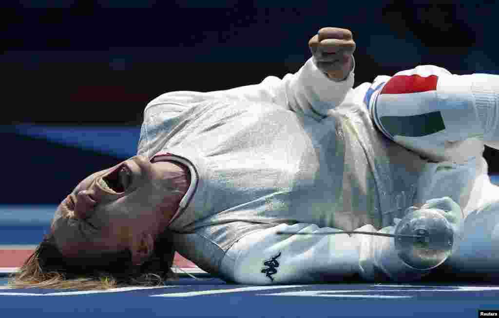 Italy's Valentina Vezzali celebrates defeating Tunisia's Ines Boubakri (not pictured) during their women's Individual Foil quarterfinal fencing competition at the ExCel venue at the London 2012 Olympic Games July 28, 2012. 