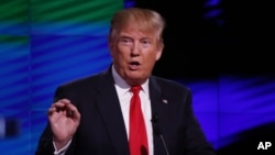 FILE - Then-presidential candidate Donald Trump speaks during the Republican presidential debate in Coral Gables, Florida, March 10, 2016.