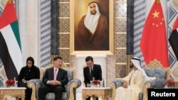 Prime Minister and Vice President of the United Arab Emirates and Ruler of Dubai Sheikh Mohammed bin Rashed al-Maktoum meets with Chinese President Xi Jinping at the Presidential Palace in Abu Dhabi, July 20, 2018. 