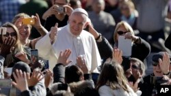 Pope Francis arrives for his weekly general audience in St.Peter's Square, at the Vatican, Wednesday, March 1, 2017.