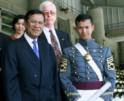 FILE- Cambodia's Prime Minister Hun Sen (L) stands with his son Hun Manet after graduation ceremonies at the United States Military Academy at West Point, May 29. Hun Sen's son, was one of the 934 cadets to graduate. (Reuters)