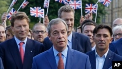 Nigel Farage, the leader of the UK Independence Party speaks to the media on College Green in London, June 24, 2016. (AP Photo/Matt Dunham)