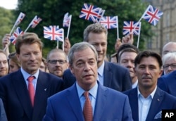 Nigel Farage, the leader of the UK Independence Party speaks to the media on College Green in London, June 24, 2016.