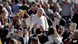 Pope Francis arrives for his weekly general audience in St.Peter's Square, at the Vatican, Wednesday, March 1, 2017.