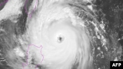 This Himawari satellite image from the National Oceanic and Atmospheric Administration (NOAA) taken and released on October 30, 2024 shows typhoon Kong-rey as it develops over the West Pacific.