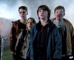 Left to right: Gabriel Basso plays Martin, Ryan Lee plays Cary, Joel Courtney plays Joe Lamb, and Riley Griffiths plays Charles in SUPER 8, from Paramount Pictures.