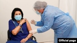 Georgian President Salome Zurabishvili receives a shot of the AstraZeneca vaccine against the coronavirus disease in Tbilisi, Georgia March 18, 2021. (Georgian Presidential Press Service/Handout via REUTERS)