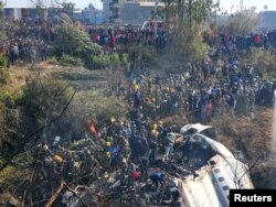 A general view of people gathered after the plane crash in Pokhara, Nepal Jan. 15, 2023 in this picture obtained from social media.