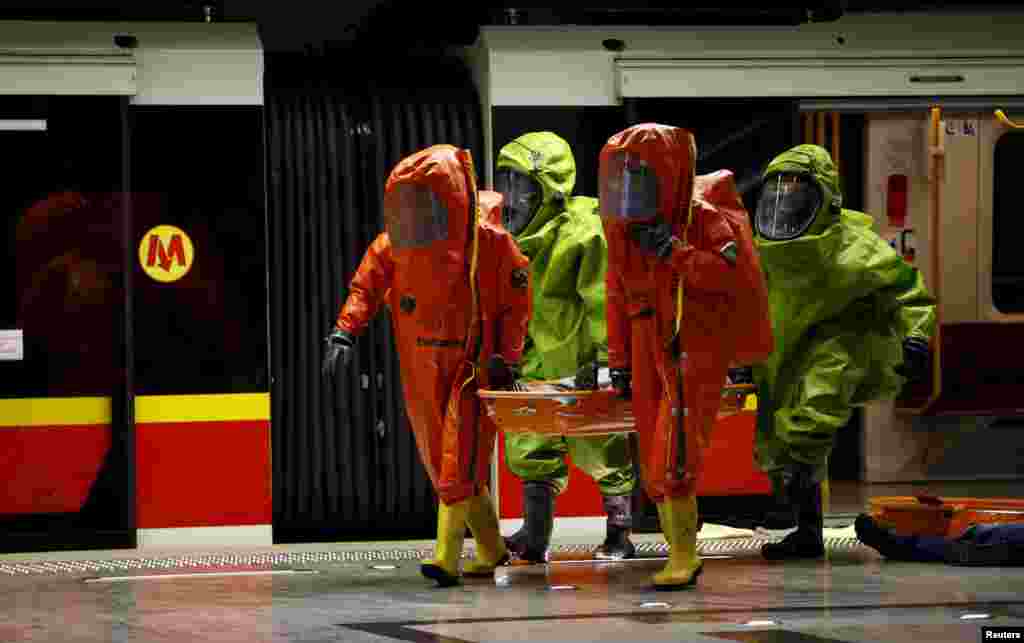 Polish special forces train during a joint services exercise of a simulated chemical attack in the Warsaw underground.