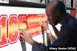 Until recently Kenya had banned any painting on Nairobi’s 10,000 matatus other than a standard yellow stripe, Nairobi, Jan. 23, 2015. (Hilary Heuler/for VOA)