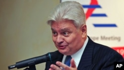 Herve Ladsous, then French ambassador to China, gestures during a briefing with Serge Abou, the European Union ambassador to China [not pictured], in Beijing on October 16, 2008. (file photo)