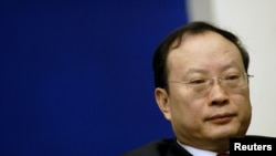 FILE - Wang Baoan attends a news conference in Beijing, China.