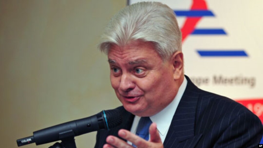Herve Ladsous, then French ambassador to China, gestures during a briefing with Serge Abou, the European Union ambassador to China [not pictured], in Beijing on October 16, 2008. (file photo)