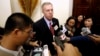 FILE - U.S. Ambassador to Vietnam, Ted Osius (C) speaks to the media at a bilateral conference at the Government Guesthouse in Hanoi.