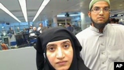 This July 27, 2014 photo provided by U.S. Customs and Border Protection shows Tashfeen Malik, left, and Syed Farook, as they passed through O'Hare International Airport in Chicago. The husband and wife died on Dec. 2, 2015, in a gun battle with authorities several hours after their assault on a gathering of Farook's colleagues in San Bernardino, Calif. 