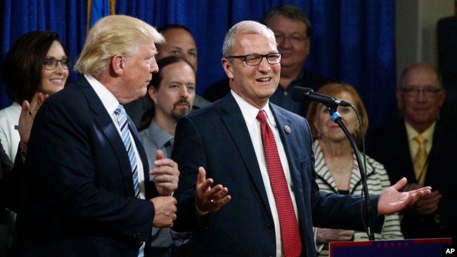 FILE - U.S. Rep. Kevin Cramer, R-N.D., right, talks about being one of the first to endorse then Republican presidential candidate Donald Trump during the North Dakota Republican National Convention in Bismarck, May 26, 2016.