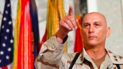 FILE - In this Aug. 7, 2003, photo, Major General Raymond Odierno, commander of the US Army Fourth Infantry Division, gestures during a news conference in Tikrit, about 180 kilometers northwest of Baghdad, Iraq.