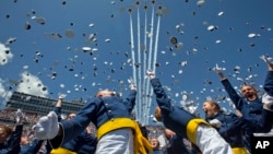FILE - The Air Force Thunderbirds fly overhead as graduating cadets celebrate with the "hat toss" after graduation ceremonies at the 2016 class of the U.S. Air Force Academy, in Colorado Springs, Colorado, June 2, 2016. 