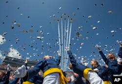 The Air Force Thunderbirds fly overhead as graduating cadets celebrate with the "hat toss" after graduation ceremonies at the 2016 class of the U.S. Air Force Academ, in Colorado Springs, Colorado, June 2, 2016.